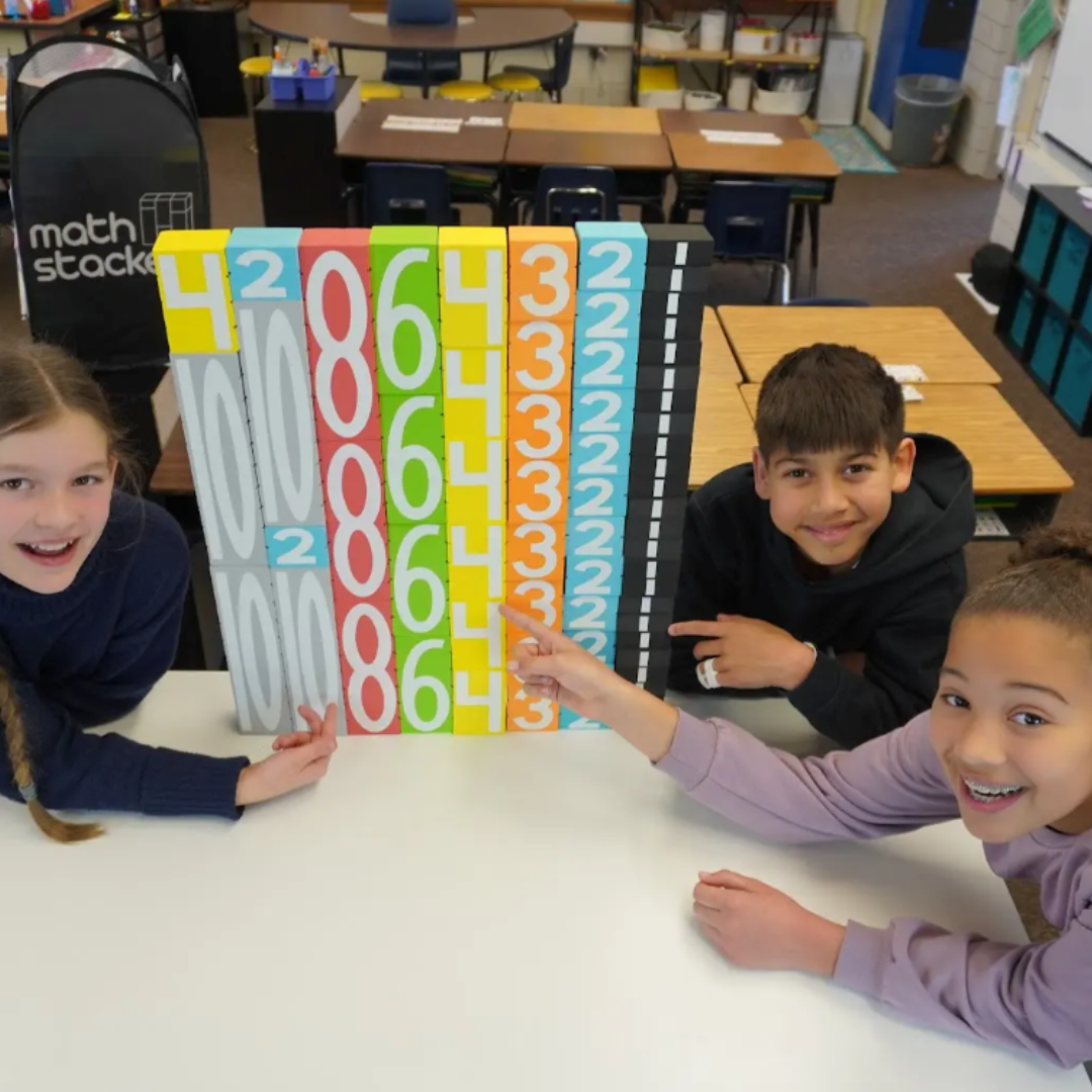 Children in a classroom setting with Math Stackers